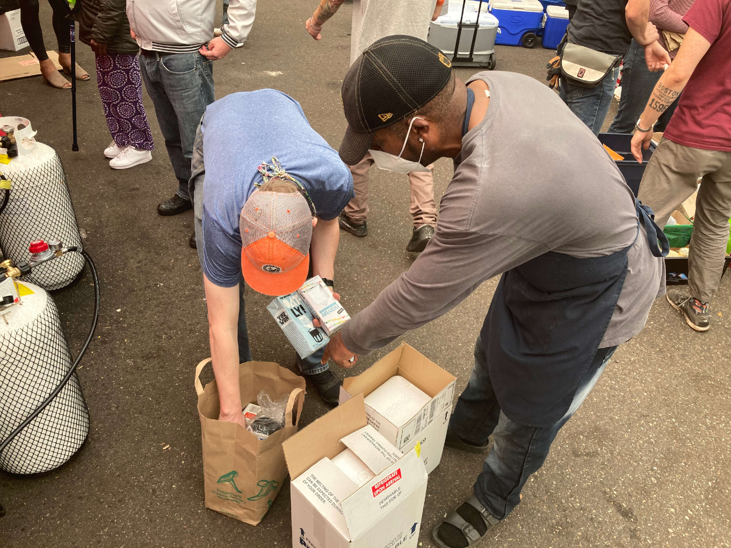 Gary Floyd (right) assesses newly donated goods.