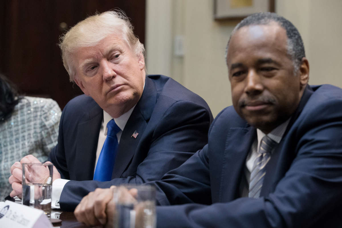 President Trump sits beside the Department of Housing and Urban Development Secretary Ben Carson in the Roosevelt Room of the White House on February 1, 2017, in Washington, D.C.