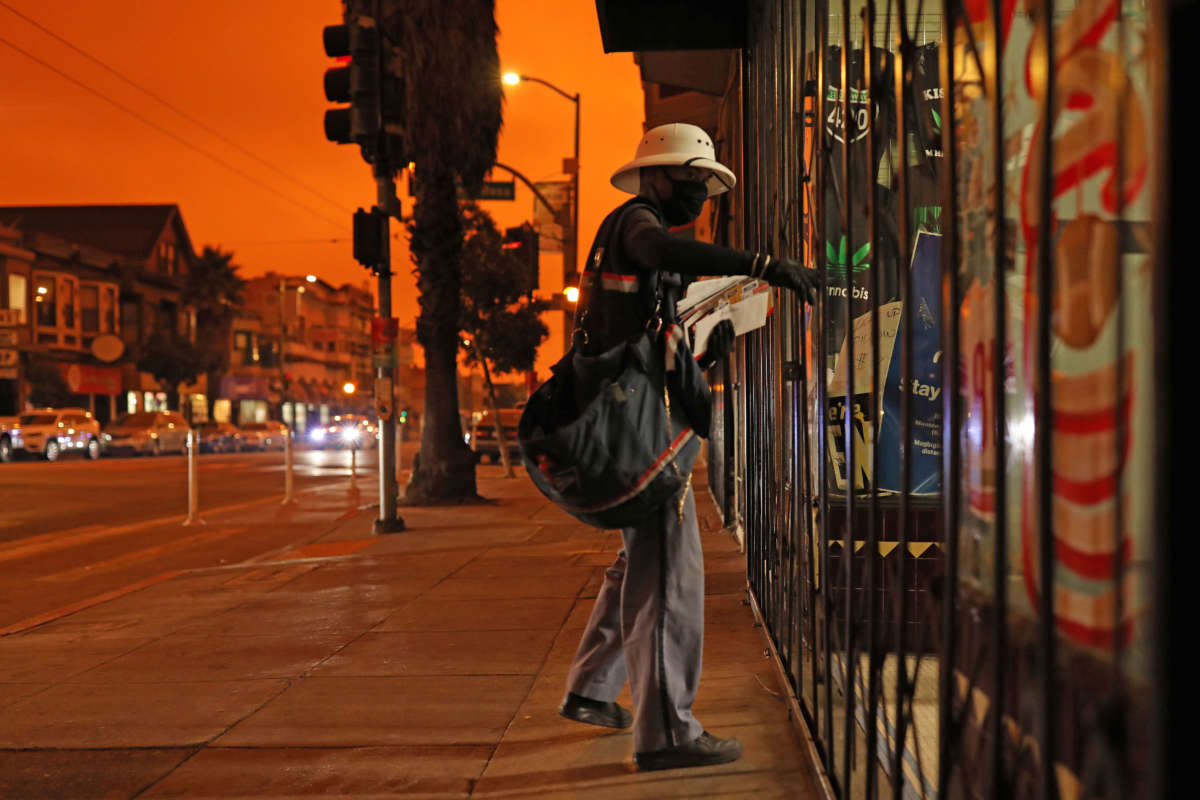 A mailman makes a delivery on September 9, 2020, in San Francisco, California.