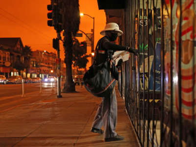 A mailman makes a delivery on September 9, 2020, in San Francisco, California.