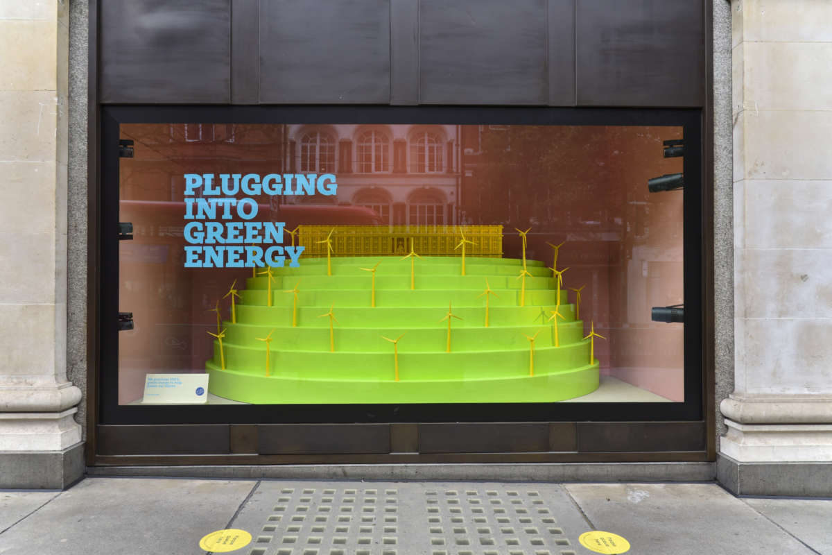 a diorama of wind turbines in a store window