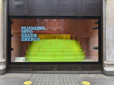 a diorama of wind turbines in a store window