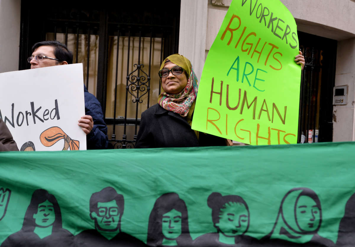 A group supporting domestic workers' rights demonstrate across the street from the Indian Consulate General, December 20, 2013, in New York City.