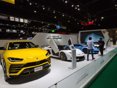 A Lamborghini Urus car (left) along with other Lamborghini car models seen at the Lamborghini stand during the 41st Bangkok International Motor Show 2020 on July 15, 2020.