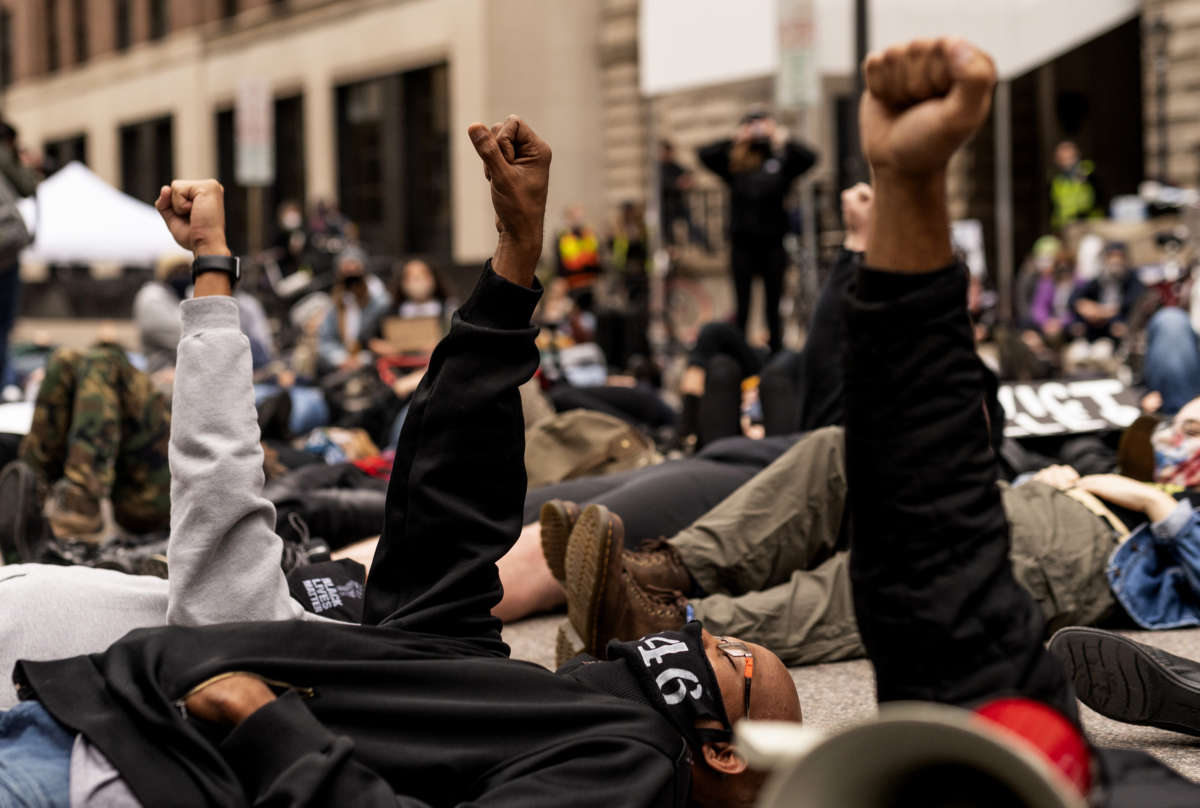 People stage a die in outside the Hennepin County Family Justice Center on September 11, 2020, in Minneapolis, Minnesota.