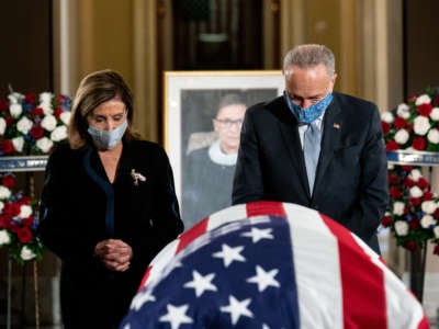 House Speaker Nancy Pelosi and Senate Minority Leader Chuck Schumer pay their respects during a memorial service for Justice Ruth Bader Ginsburg as she lies in state in Statuary Hall of the U.S. Capitol on September 25, 2020, in Washington, D.C.