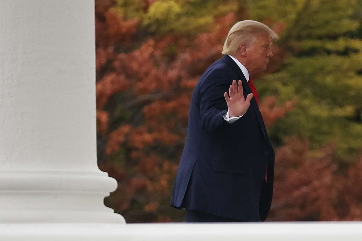 Donald Trump waves to journalists as he returns to the White House following a trip to Wisconsin on September 1, 2020, in Washington, D.C.