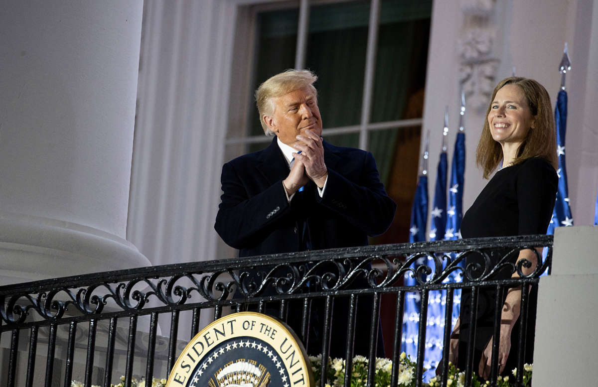 President Trump stands with newly sworn in Supreme Court Associate Justice Amy Coney Barrett during a ceremonial event on the South Lawn of the White House on October 26, 2020, in Washington, D.C.