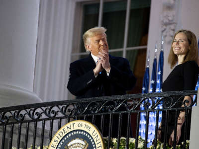 President Trump stands with newly sworn in Supreme Court Associate Justice Amy Coney Barrett during a ceremonial event on the South Lawn of the White House on October 26, 2020, in Washington, D.C.