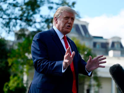 President Trump speaks to the media as he walks to Marine One on the South Lawn of the White House in Washington, D.C., on September 30, 2020.