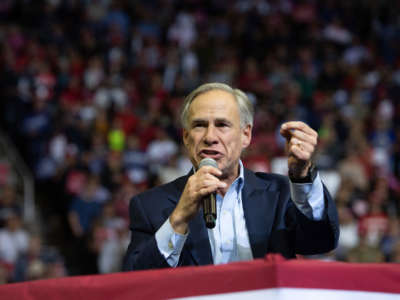 Texas Republican Gov. Greg Abbott speaks during a Trump rally at the Toyota Center in Houston, Texas, October 22, 2018.