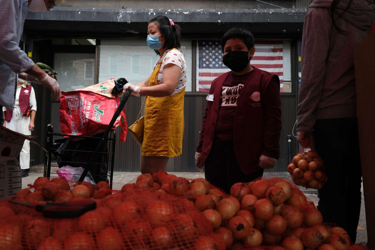 People receive food outside of a Brooklyn mosque and cultural center on September 18, 2020, in New York City.