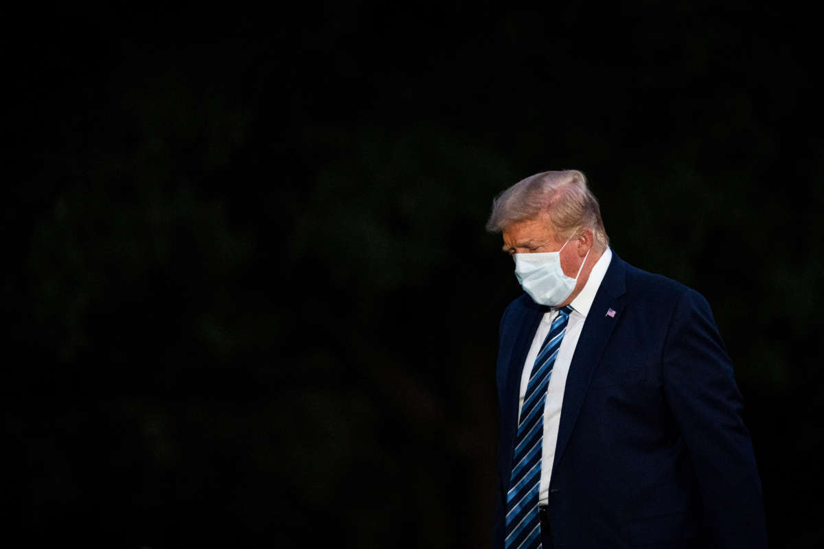 President Trump disembarks Marine One and walks across the South Lawn as he returns home after receiving treatments for the COVID-19 coronavirus at Walter Reed National Military Medical Center, at the White House on October 5, 2020, in Washington, D.C.