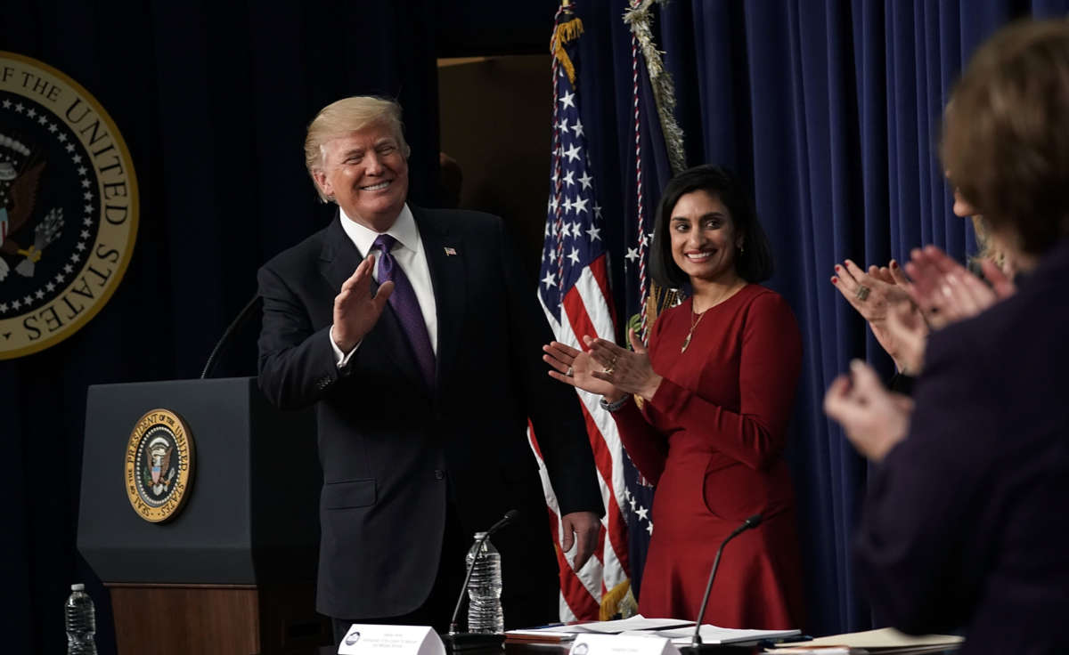 President Trump acknowledges the audience as Administrator of the Centers for Medicare and Medicaid Services Seema Verma looks on at the South Court Auditorium of the Eisenhower Executive Office Building, January 18, 2018, in Washington, D.C.