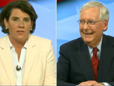 Mitch McConnell laughs as Amy McGrath speaks during their debate on October 13, 2020.