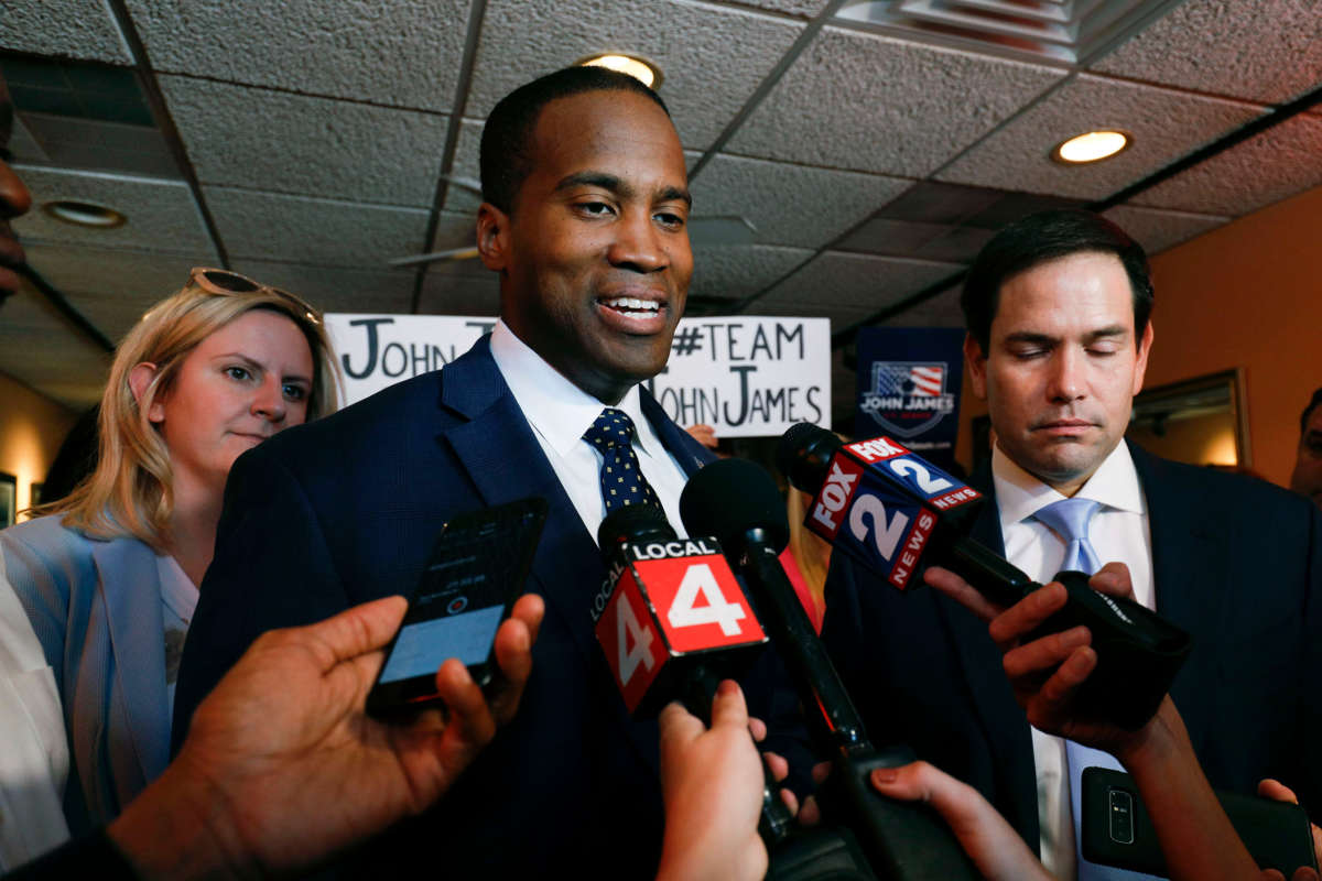 Michigan GOP Senate candidate John James (left) campaigns with the help of Sen. Marco Rubio (right) at Senor Lopez Restaurant, August 13, 2018, in Detroit, Michigan.