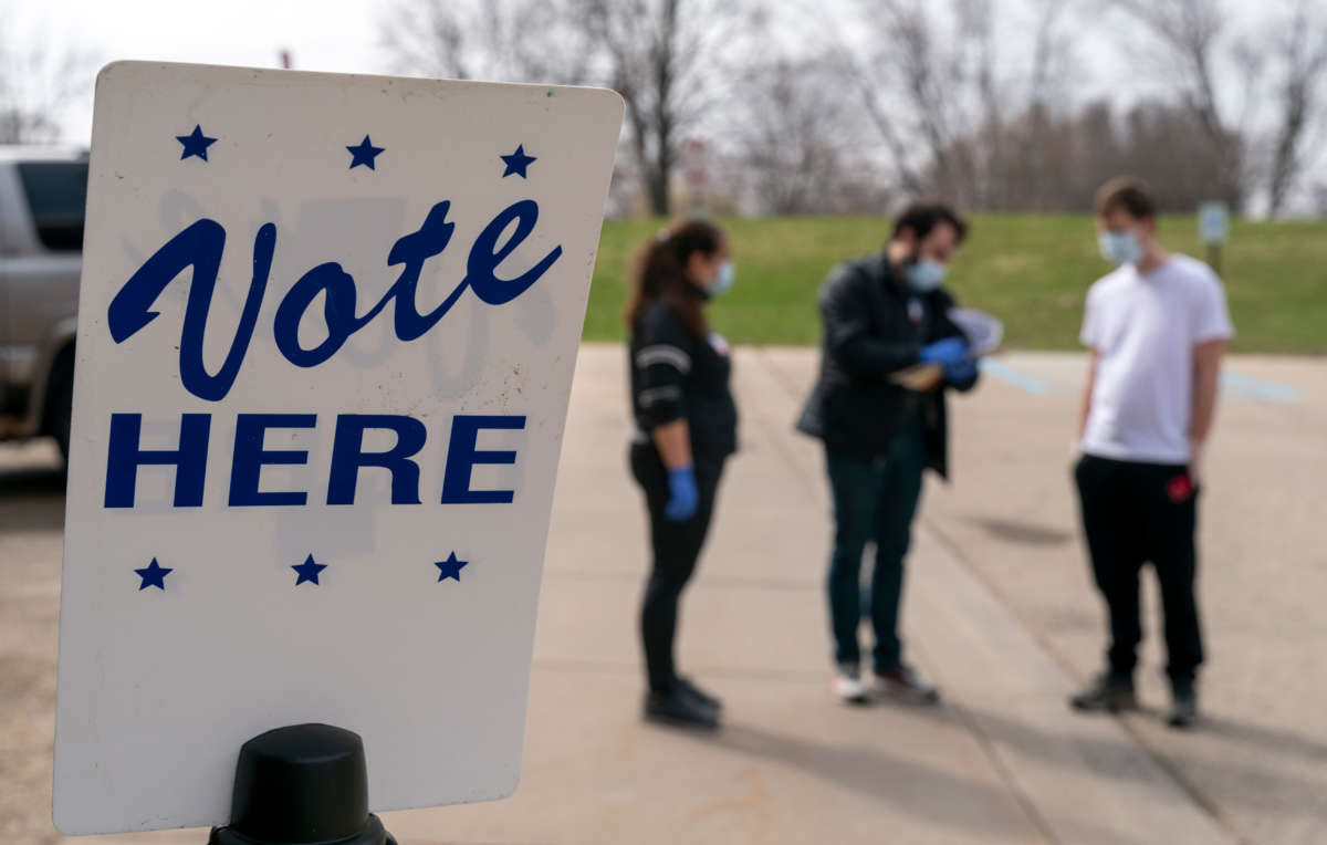 A poll worker is seen during curbside voting on April 7, 2020, in Madison, Wisconsin.