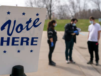 A poll worker is seen during curbside voting on April 7, 2020, in Madison, Wisconsin.