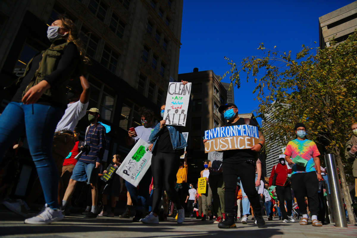 Protestors gather at Boston City hall and march through the Boston downtown as they march to demand immediate action for climate justice at Boston, Massachusetts, October 15, 2020.