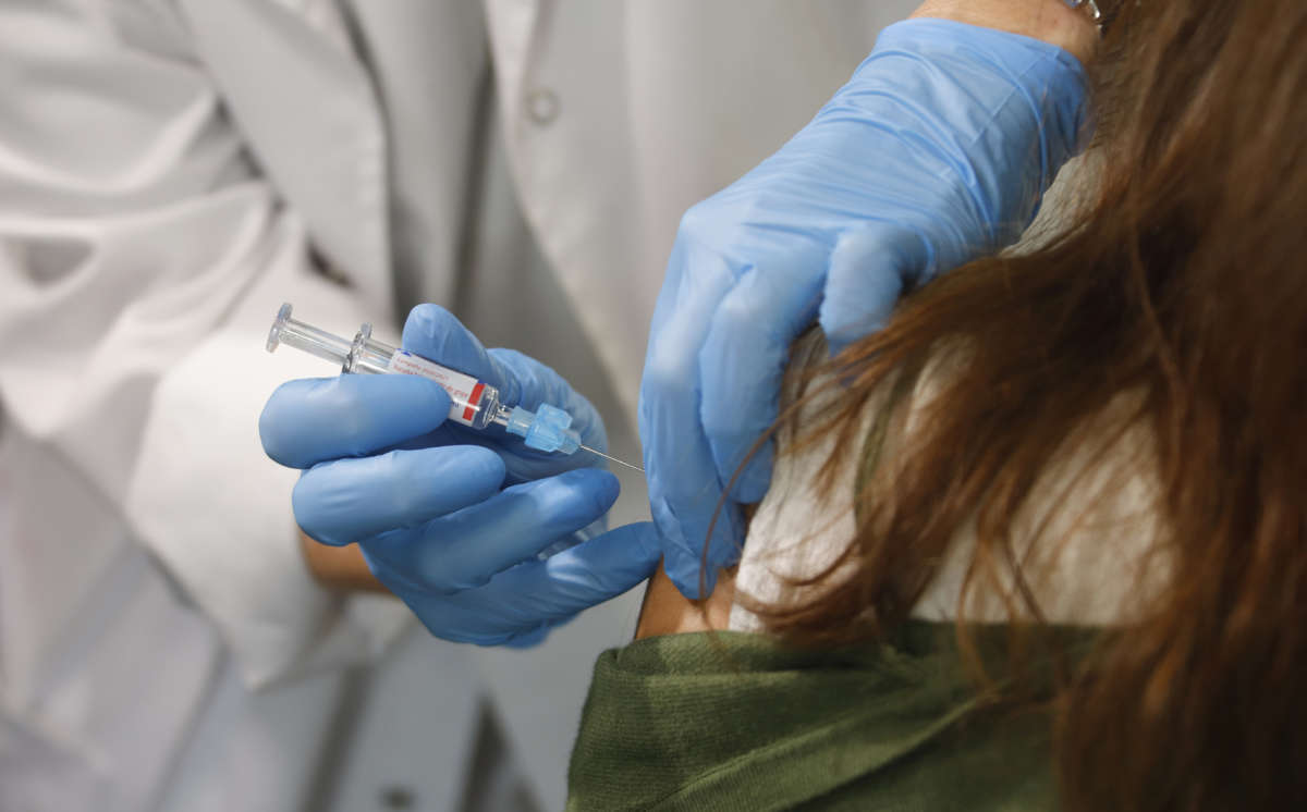 A woman recieves a vaccination