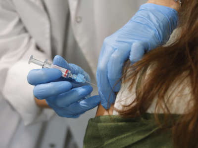 A woman recieves a vaccination
