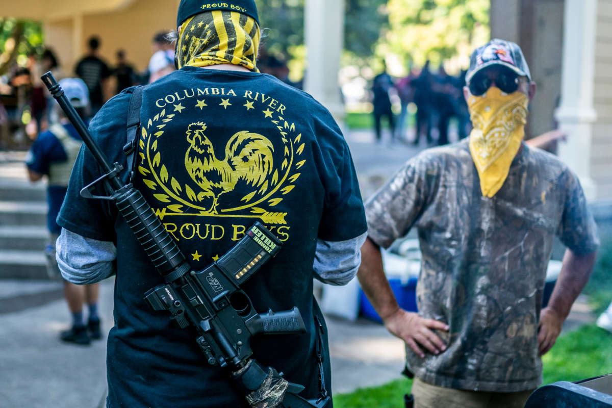 Armed members of the far-right group Proud Boys stand guard during a memorial for a Patriot Prayer member on September 5, 2020, in Vancouver, Washington.