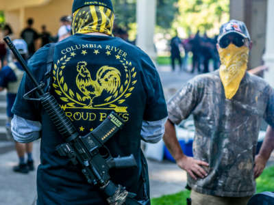 Armed members of the far-right group Proud Boys stand guard during a memorial for a Patriot Prayer member on September 5, 2020, in Vancouver, Washington.