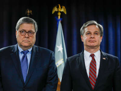 Attorney General William Barr and FBI Director Christopher Wray stand together to announce a crime reduction initiative on December 18, 2019 in Detroit, Michigan.