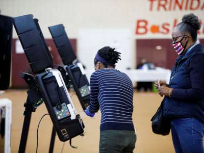 Voters vote at booths