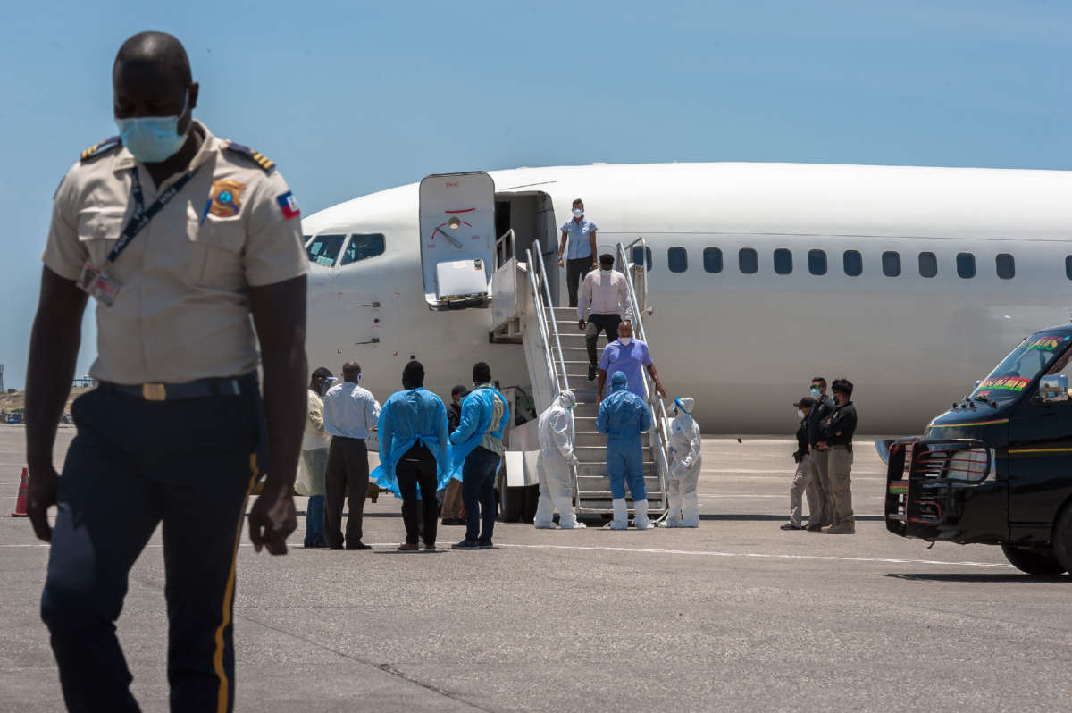 Haitians are tested by Haitian health workers after a deportation flight from the U.S. in Port-au-Prince, Haiti, on May 26, 2020.