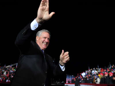 White House Chief of Staff Mark Meadows waves as he arrives for a campaign rally for President Trump at Waukesha County Airport in Waukesha, Wisconsin, on October 24, 2020.