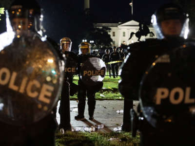 Members of the U.S. Secret Service hold a perimeter near the White House as demonstrators gather to protest the killing of George Floyd on May 30, 2020, in Washington, D.C.
