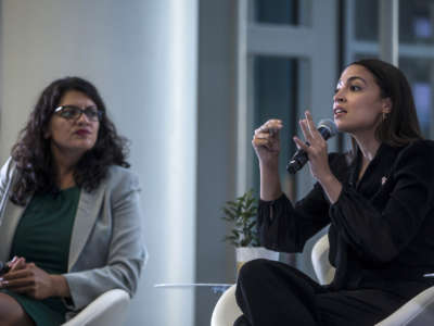 Rep. Alexandria Ocasio-Cortez speaks during a town hall hosted by the NAACP on September 11, 2019, in Washington, D.C. Also pictured is Rep. Rashida Tlaib.