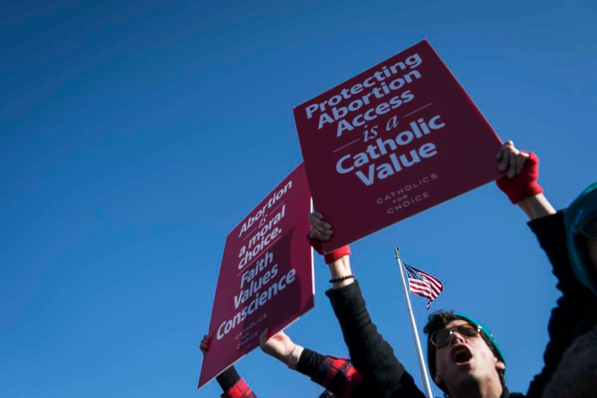 Demonstrators shout slogans and hold banners in an abortion rights rally outside of the Supreme Court as the justices hear oral arguments in the June Medical Services v. Russo case on March 4, 2020, in Washington, D.C.