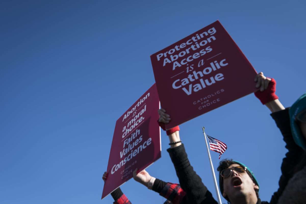 Demonstrators shout slogans and hold banners in an abortion rights rally outside of the Supreme Court as the justices hear oral arguments in the June Medical Services v. Russo case on March 4, 2020, in Washington, D.C.