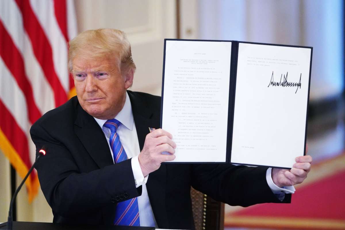 Donald Trump holds an executive order on "Continuing the President's National Council for the American Worker and the American Workforce Policy Advisory Board" which he signed during an American Workforce Policy Advisory Board Meeting in the East Room of the White House in Washington, D.C., on June 26, 2020.