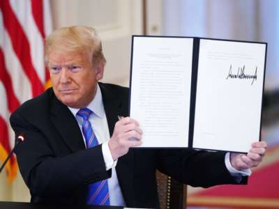 Donald Trump holds an executive order on "Continuing the President's National Council for the American Worker and the American Workforce Policy Advisory Board" which he signed during an American Workforce Policy Advisory Board Meeting in the East Room of the White House in Washington, D.C., on June 26, 2020.