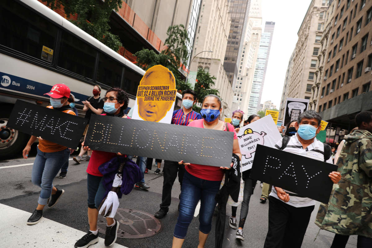 People participate in a "March on Billionaires" event on July 17, 2020, in New York City.