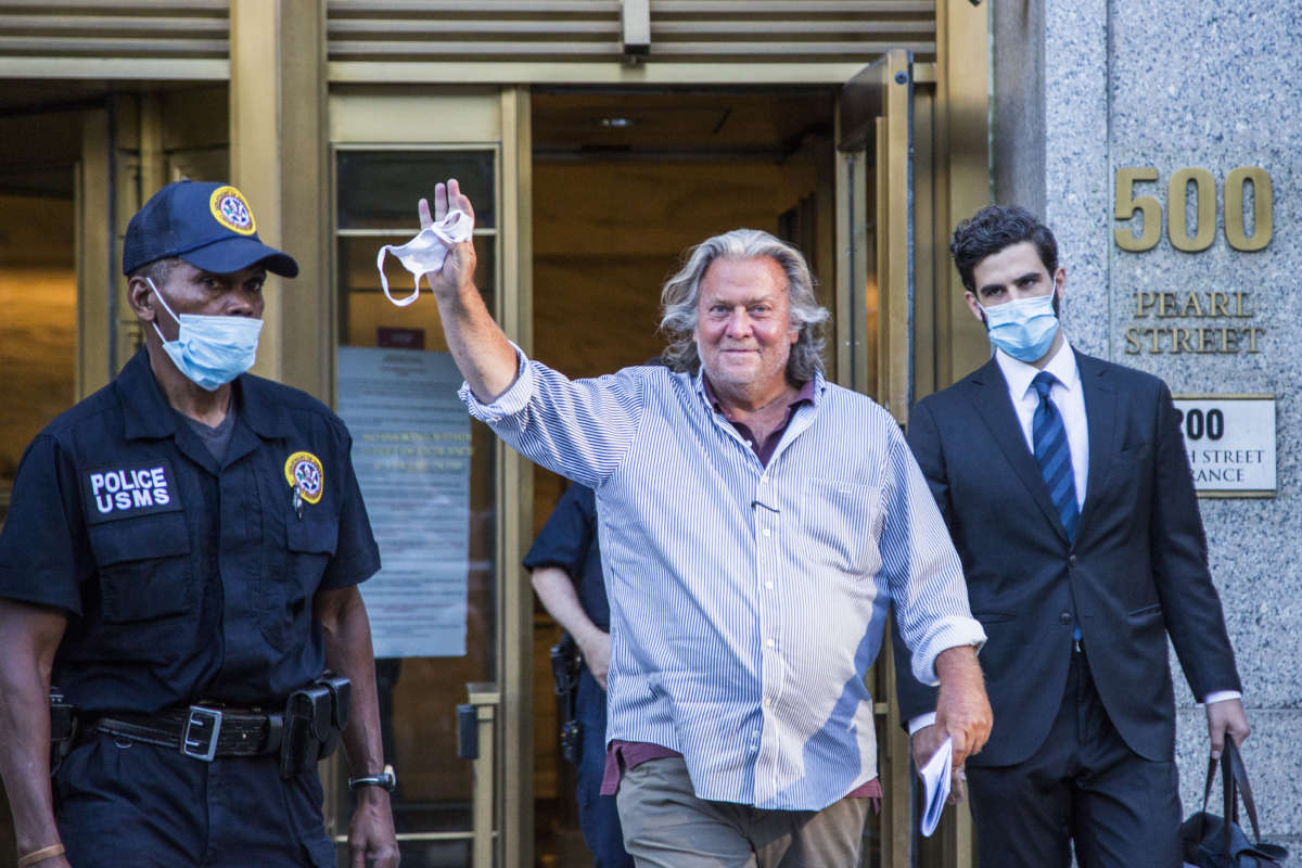 Former White House Chief Strategist Steve Bannon waves as he exits the Manhattan Federal Court on August 20, 2020, in the Manhattan borough of New York City.