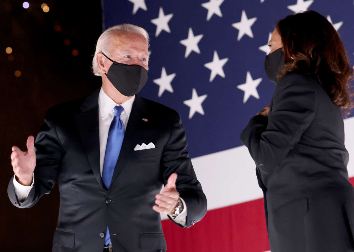 Democratic presidential nominee Joe Biden and Democratic Vice Presidential nominee Kamala Harris confer on stage outside the Chase Center after Biden delivered his acceptance speech on the fourth night of the Democratic National Convention from the Chase Center on August 20, 2020, in Wilmington, Delaware.