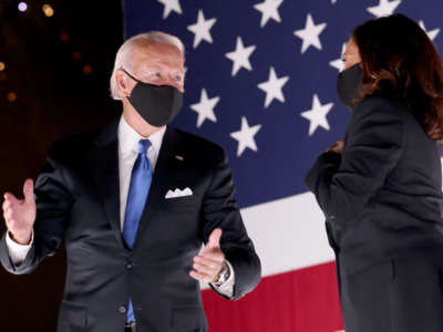 Democratic presidential nominee Joe Biden and Democratic Vice Presidential nominee Kamala Harris confer on stage outside the Chase Center after Biden delivered his acceptance speech on the fourth night of the Democratic National Convention from the Chase Center on August 20, 2020, in Wilmington, Delaware.
