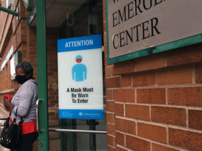 A sign in front of a hospital instructs people to wear face masks on September 14, 2020, in the Brooklyn borough of New York City.