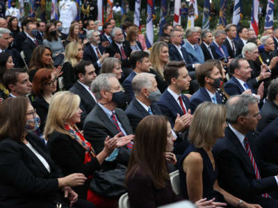 With few wearing masks to protect against the coronavirus, several Republican members of congress join other guests as President Donald Trump introduces Amy Coney Barrett as his nominee to the Supreme Court in the Rose Garden at the White House September 26, 2020, in Washington, D.C.