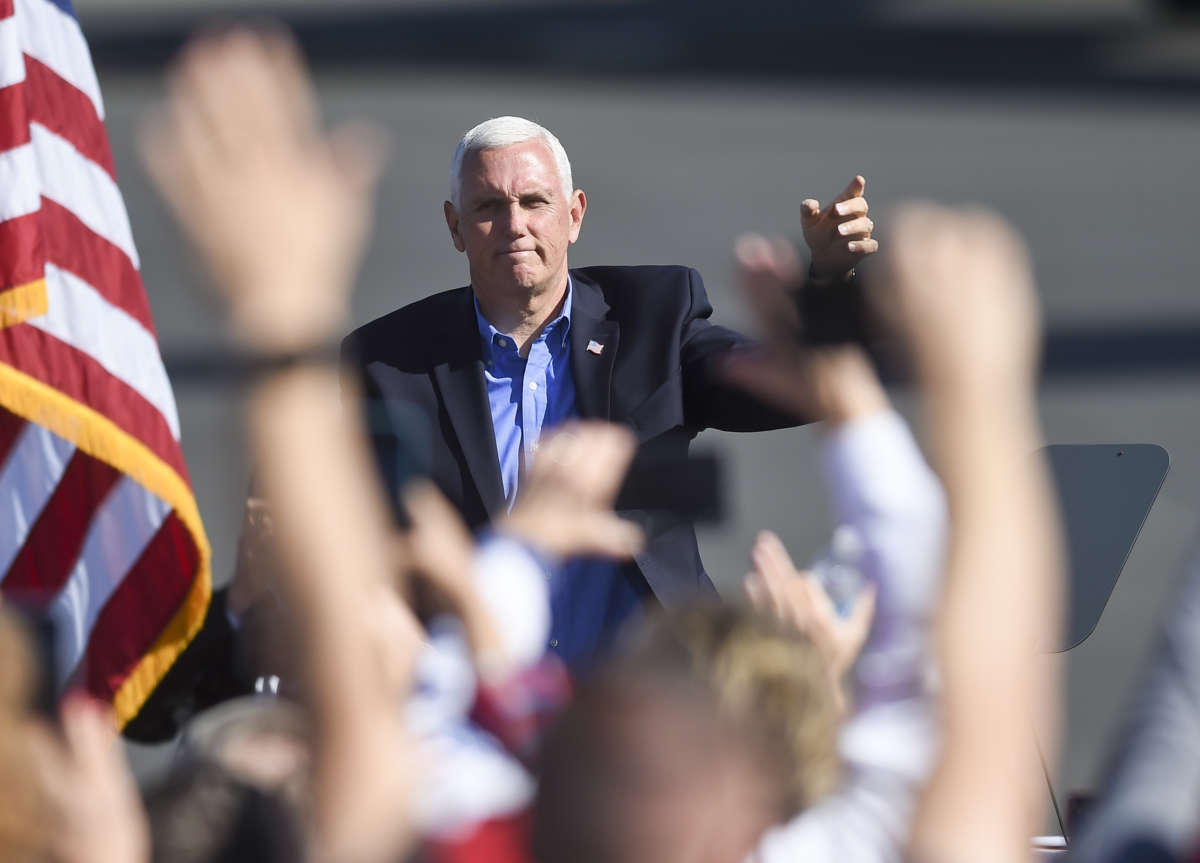 Vice President Mike Pence waves to people in the crowd. At the Reading Regional Airport in Bern Township on October 17, 2020, where Vice President Mike Pence made a stop in Air Force 2 for a campaign rally.