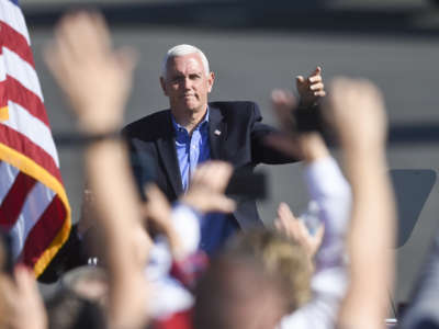 Vice President Mike Pence waves to people in the crowd. At the Reading Regional Airport in Bern Township on October 17, 2020, where Vice President Mike Pence made a stop in Air Force 2 for a campaign rally.