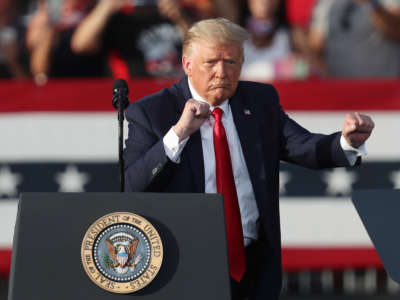 President Donald Trump dances to the music after speaking during his campaign event at The Villages Polo Club on October 23, 2020, in The Villages, Florida.