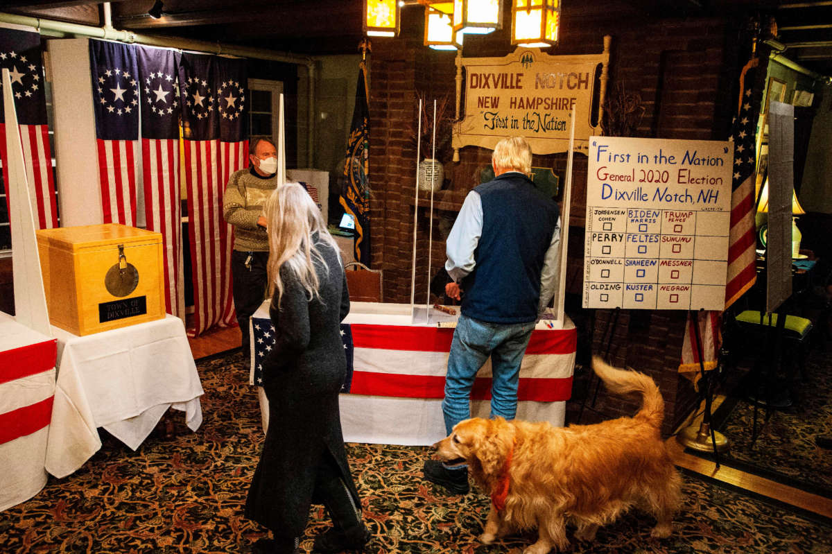 Voters gather at the Hale House at the historic Balsams Resort during midnight voting as part of the first ballots cast in the U.S. presidential election in Dixville Notch, New Hampshire, on November 3, 2020.