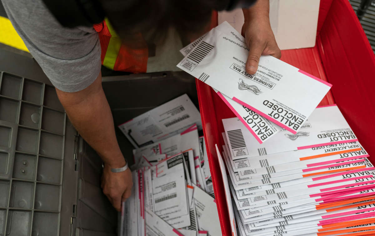 An election worker sorts submitted ballots at the Multnomah County Elections Office on November 2, 2020, in Portland, Oregon.