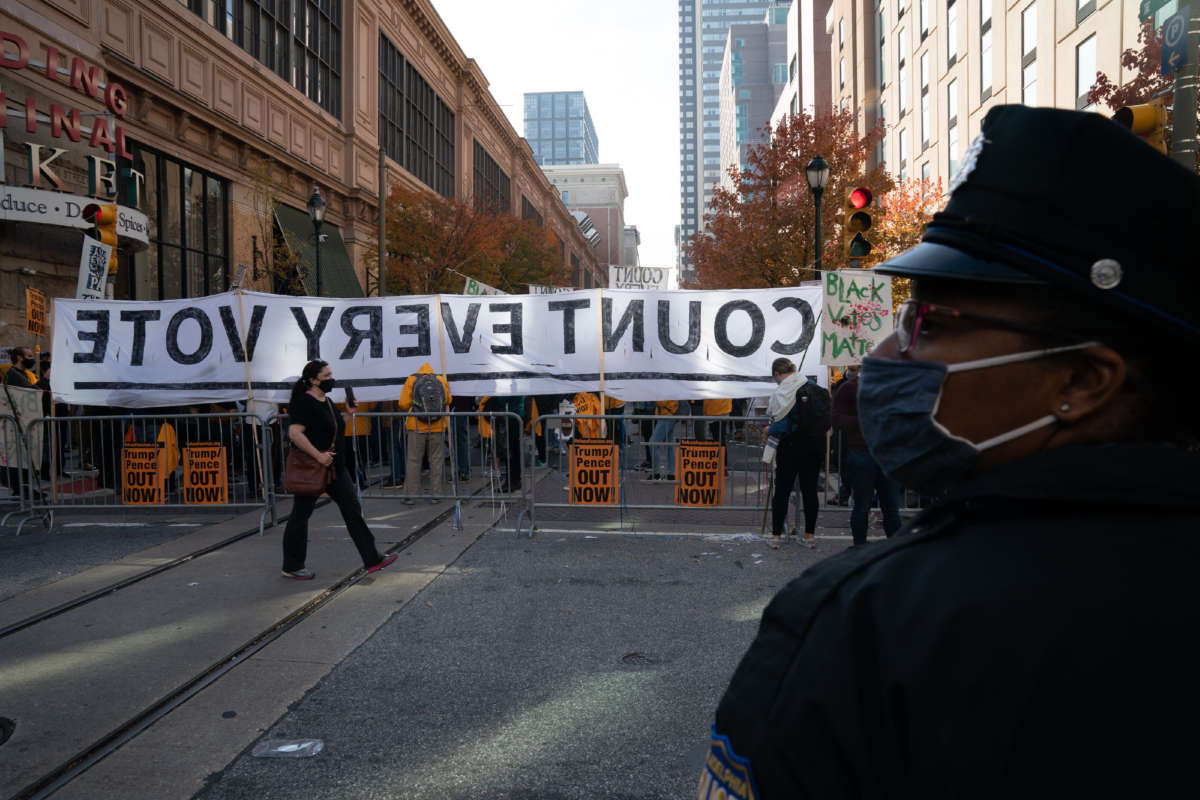 Protesters urge vote counting outside the Pennsylvania Convention Center as ballot counting continues inside on November 6, 2020, in Philadelphia.