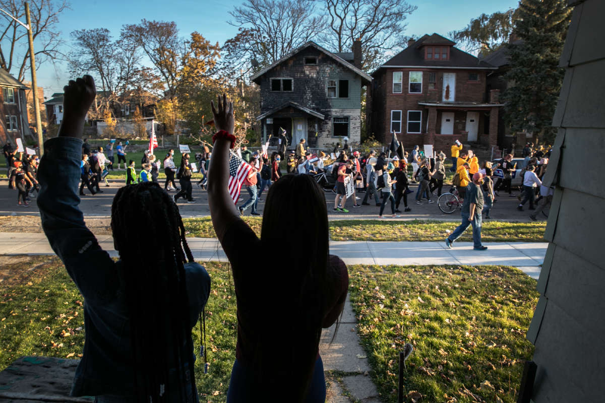 Demonstrators calling for President Trump to concede the presidency march on November 7, 2020, in Detroit, Michigan.